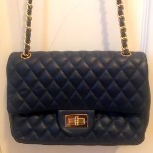 Blue quilted purse with gold hardware